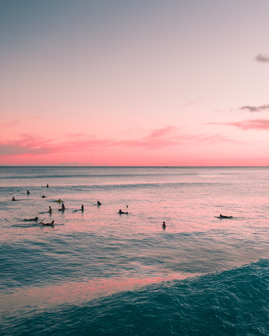 People Surfing on Sea